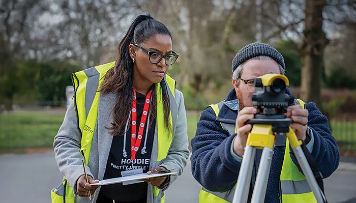 Civil engineering students using a topography camera