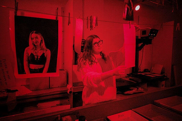 A student using the photography darkroom