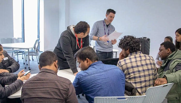 Business management students working on a live brief