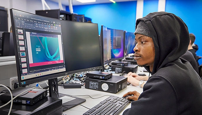 A computing student in the lab