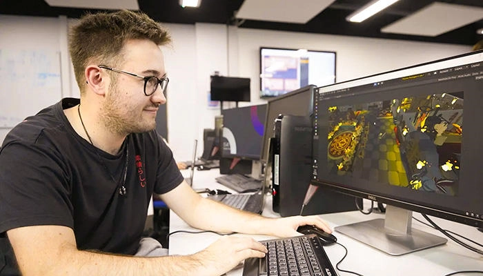 An animation student using software in the lab