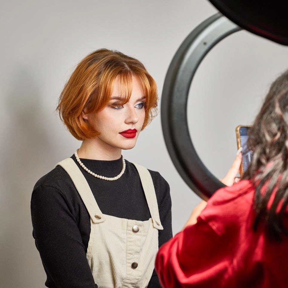 A photography student shooting a model in the infinity cove