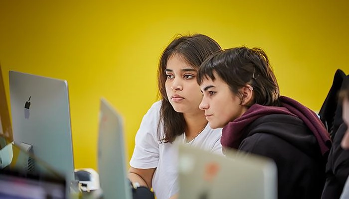 Students working at mac stations