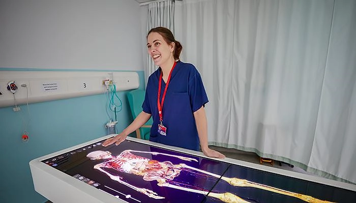 A nursing academic using the anatomage table