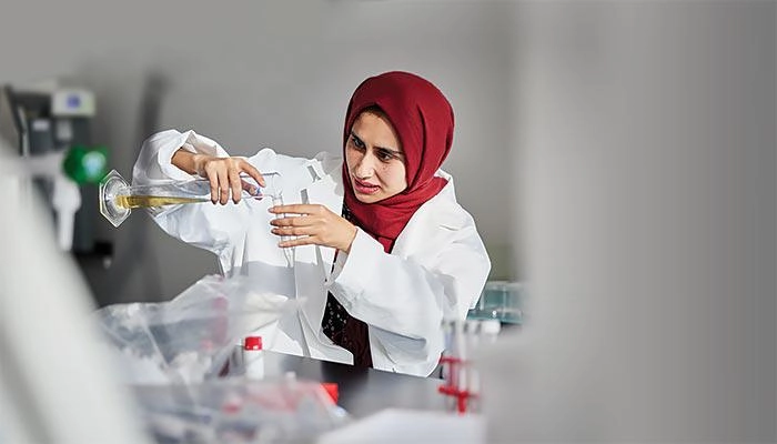 A biomedical science student conducting an experiment