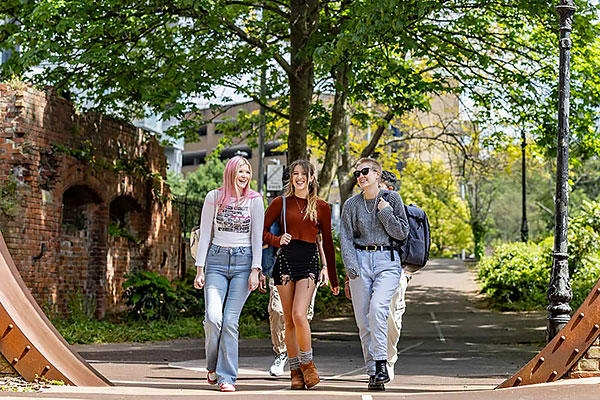 Three female students walking through Southampton