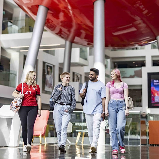 Students walking in the universities spark building