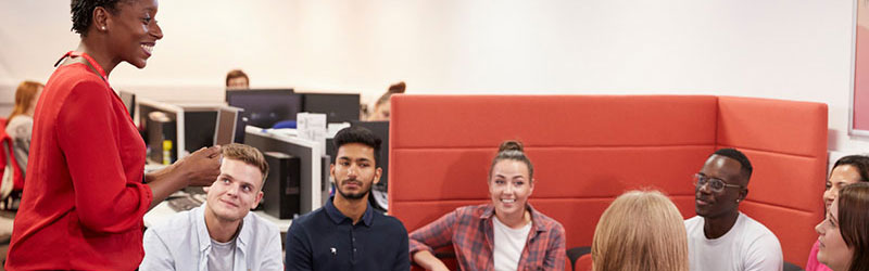 A careers adviser talking to a group of students