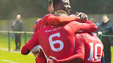 Team solent men's team hugging