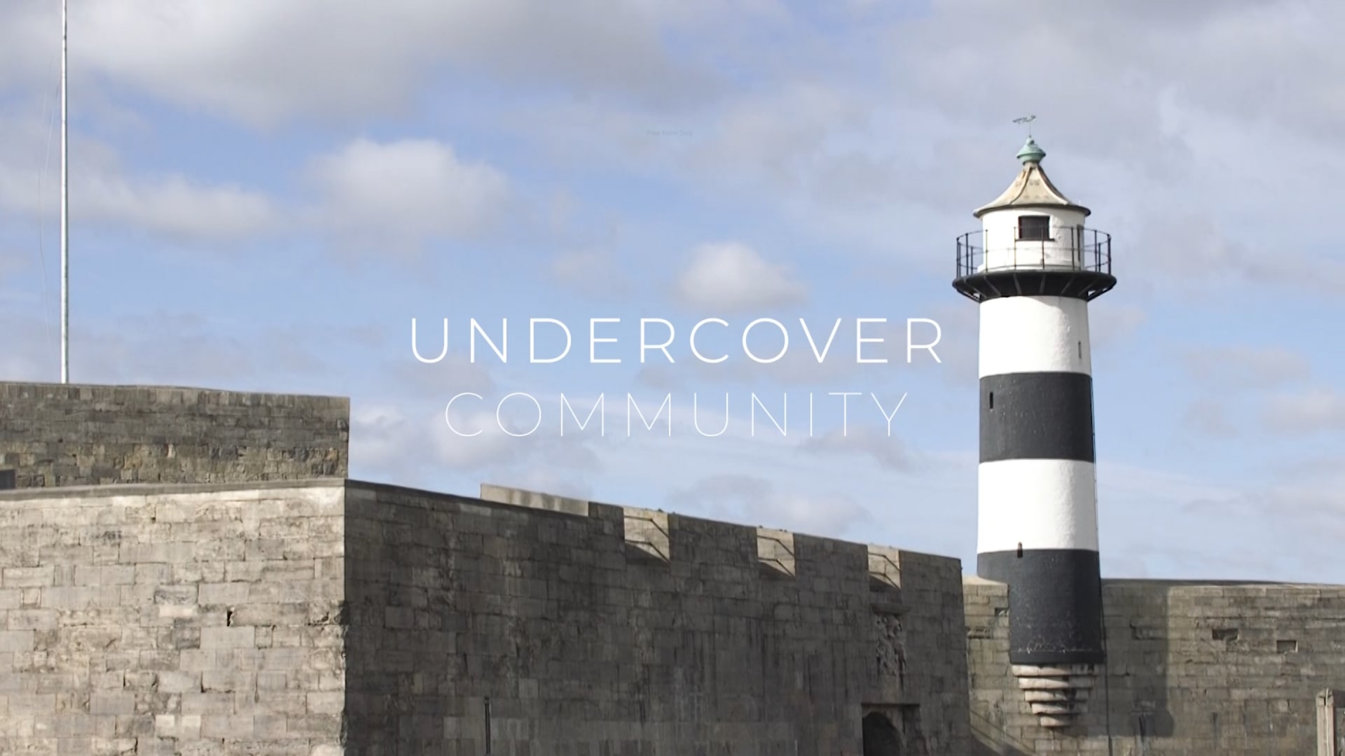 Image shows lighthouse with the words Undercover Community
