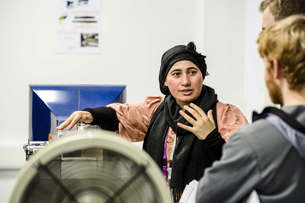 A female instructor talking to students