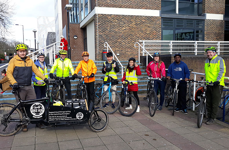 A group of cyclists with their bikes