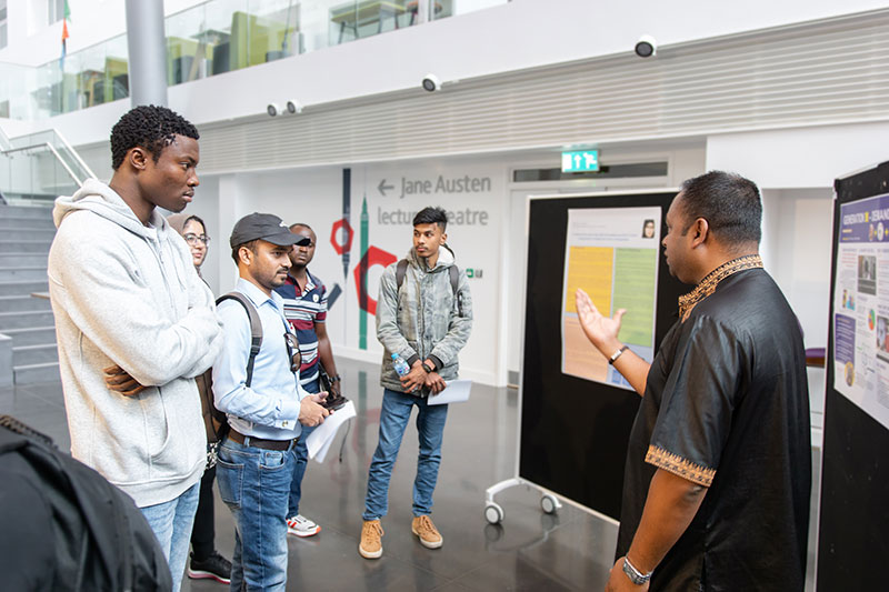 Students talking to an exhibitor