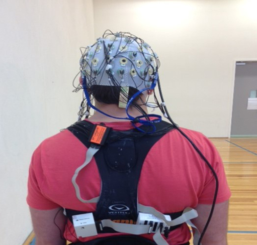 View of the back of a person wired up for EEG testing