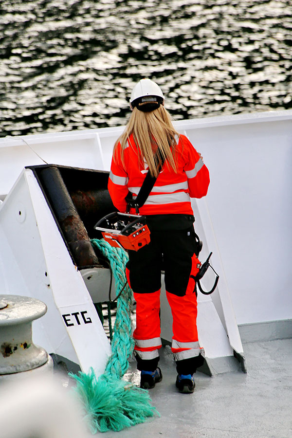 A female seafarer with a rope on board ship