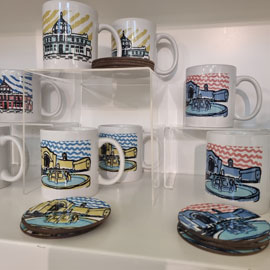 Cups and coasters displayed at the city art gallery