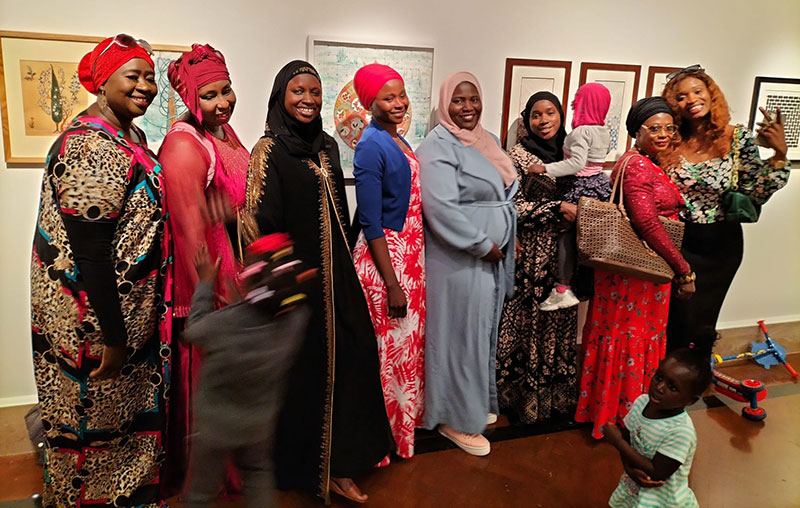 A group of women at the manifesting the unseen event