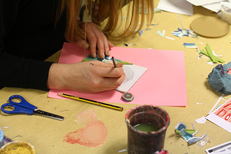 A school pupil creating their self portrait