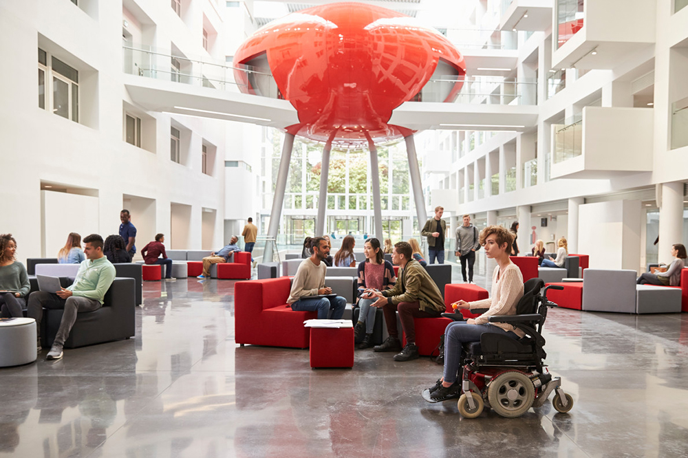 Students in the Spark Atrium with The Pod in the background
