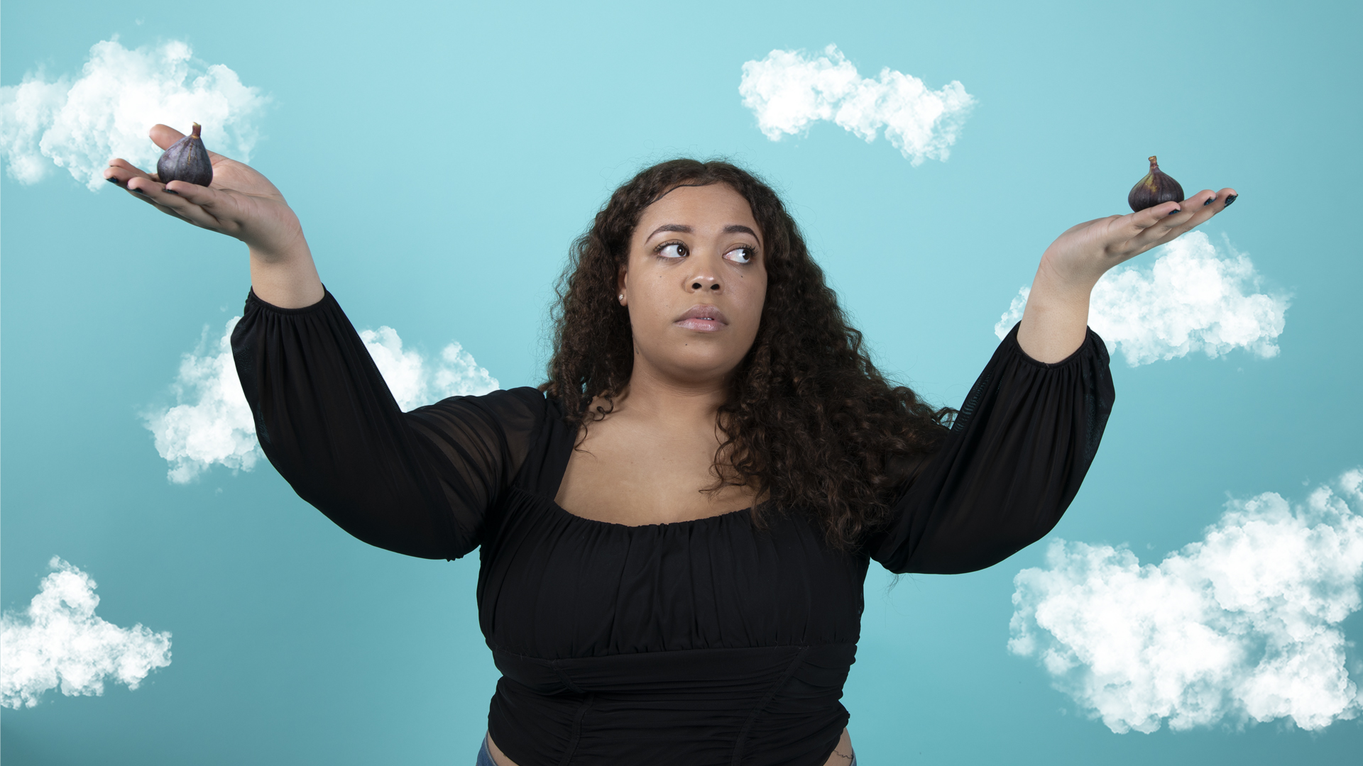 Image shows girl on cloud background holding up hands