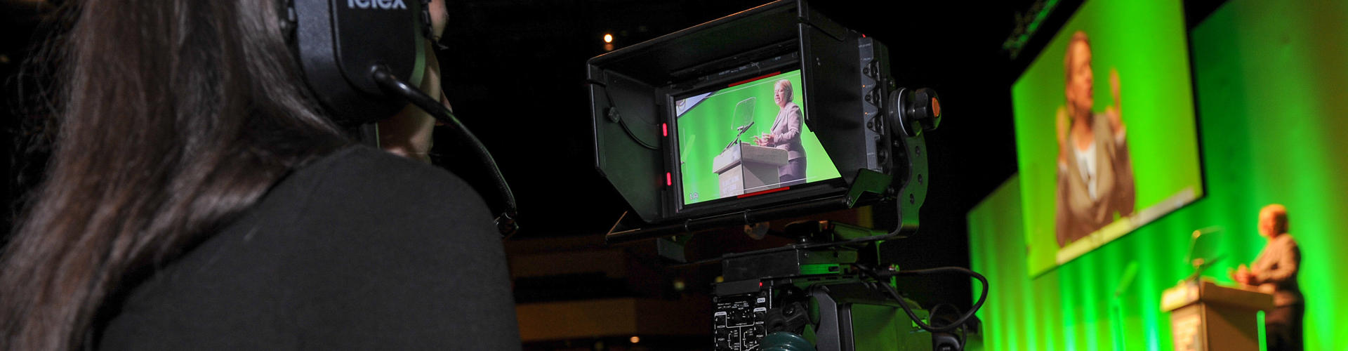 A camera person recording someone giving a talk