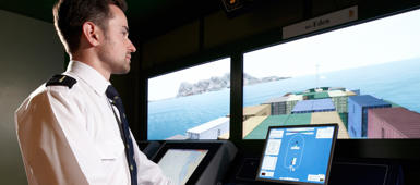 A deck cadet in a bridge simulator