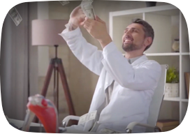 A happy man throwing money around